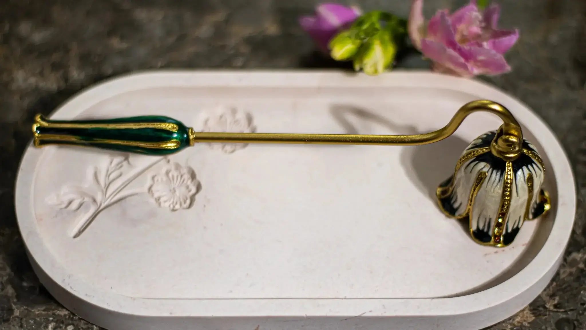 Decorative candle snuffer – functional and aesthetic accessory for candle lovers.